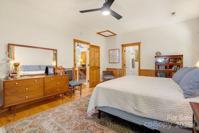 492 Henry Mountain Rd, Brevard, NC 28712 - bedroom featuring light wood-style flooring, a wainscoted wall, and ceiling fan