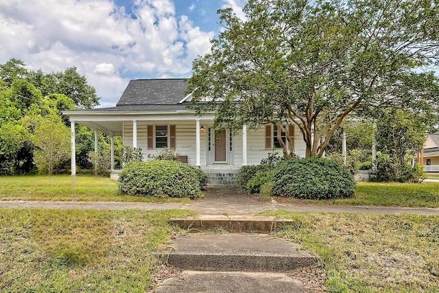315 E Marion St, Kershaw, SC 29067 - view of front of home featuring a porch, a front yard, and roof with shingles