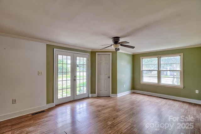 315 E Marion St, Kershaw, SC 29067 - empty room with french doors, crown molding, a ceiling fan, and wood finished floors