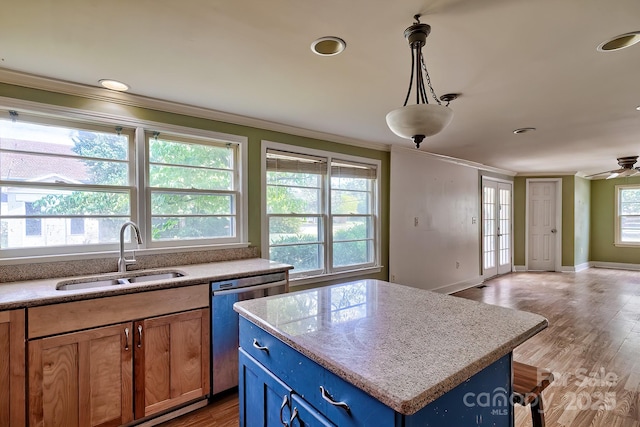 315 E Marion St, Kershaw, SC 29067 - kitchen featuring crown molding, stainless steel dishwasher, blue cabinetry, open floor plan, and a center island
