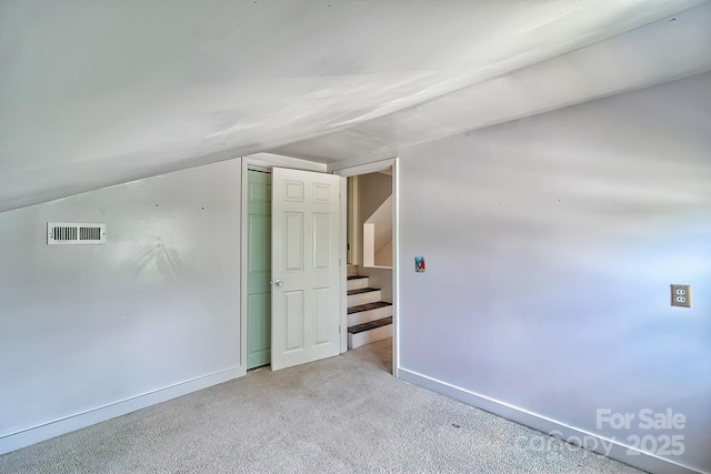 315 E Marion St, Kershaw, SC 29067 - bonus room featuring carpet floors, lofted ceiling, and stairway