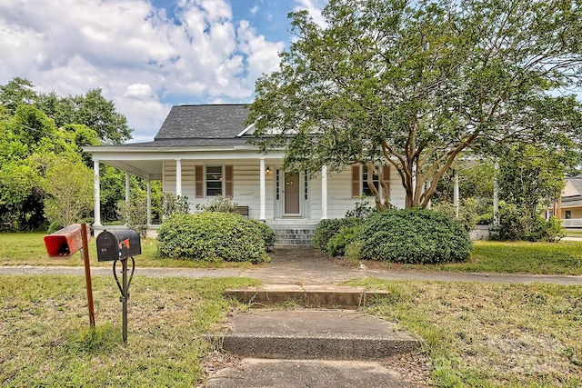 315 E Marion St, Kershaw, SC 29067 - view of front of house featuring a porch and a shingled roof