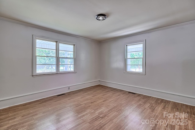 315 E Marion St, Kershaw, SC 29067 - spare room featuring crown molding and wood finished floors