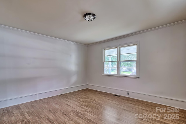 315 E Marion St, Kershaw, SC 29067 - empty room with crown molding and wood finished floors