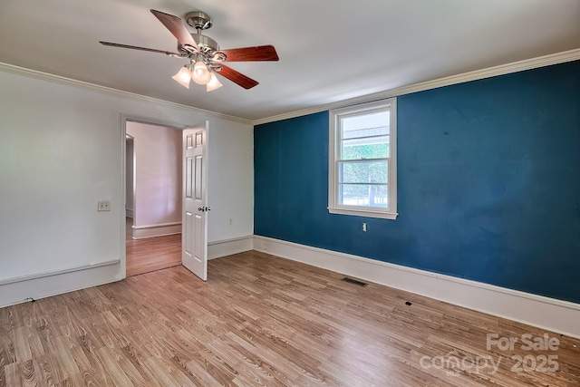 315 E Marion St, Kershaw, SC 29067 - spare room with a ceiling fan, wood finished floors, and crown molding