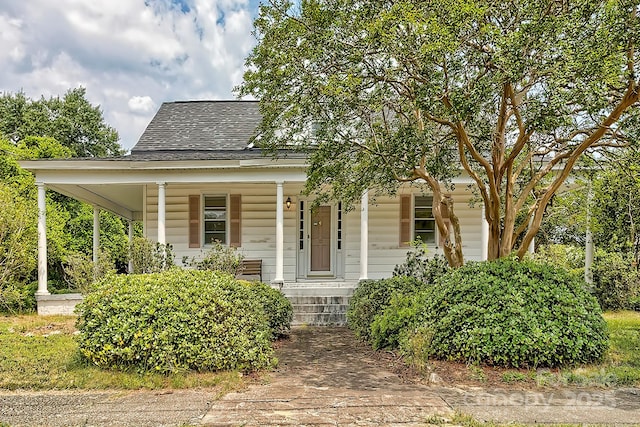 315 E Marion St, Kershaw, SC 29067 - view of front of home with covered porch and a shingled roof