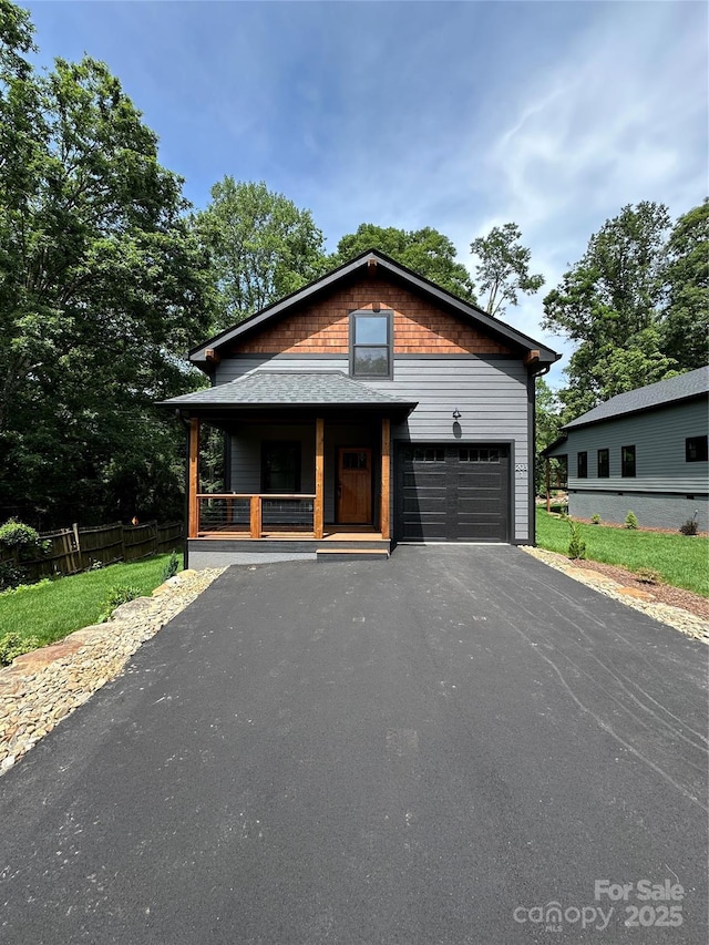 2031 S Oconeechee Ave, Black Mountain, NC 28711 - view of front of home with covered porch and driveway
