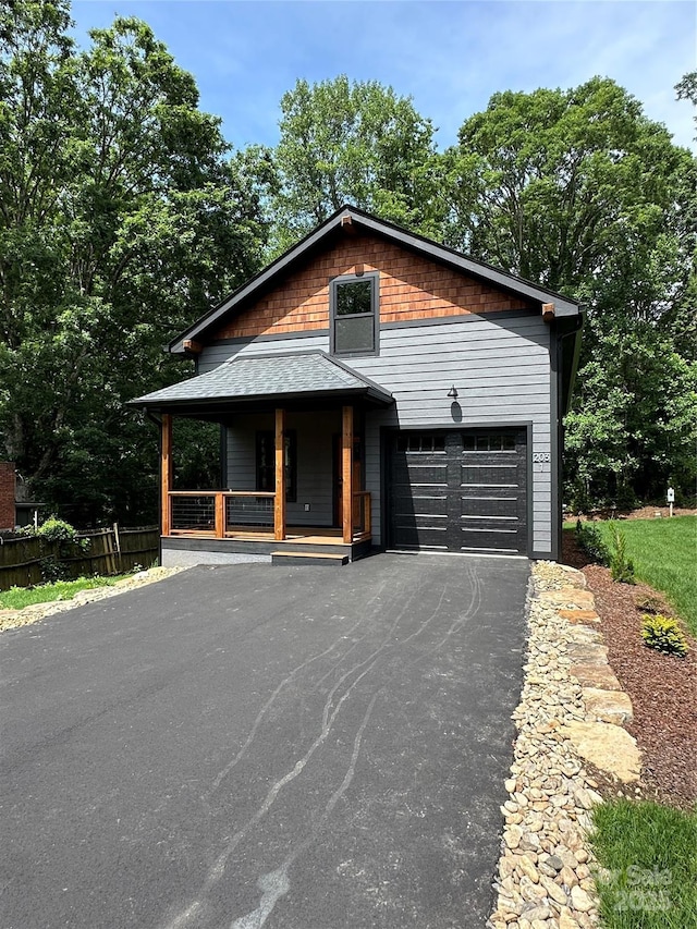 2031 S Oconeechee Ave, Black Mountain, NC 28711 - view of front of house featuring a porch and asphalt driveway
