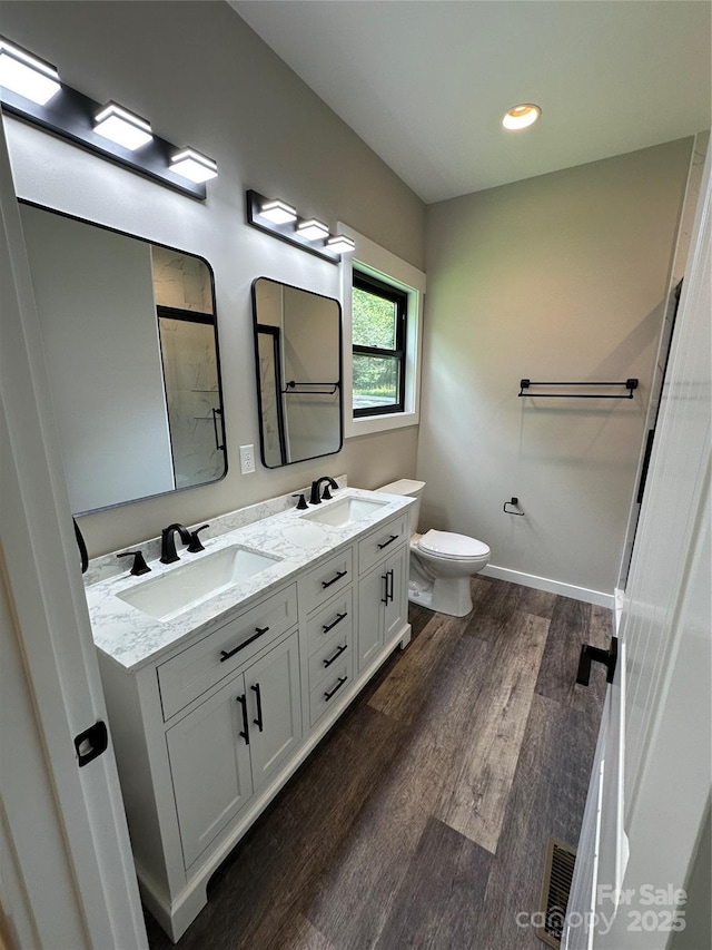 2031 S Oconeechee Ave, Black Mountain, NC 28711 - full bath featuring double vanity, wood finished floors, and a shower with shower door