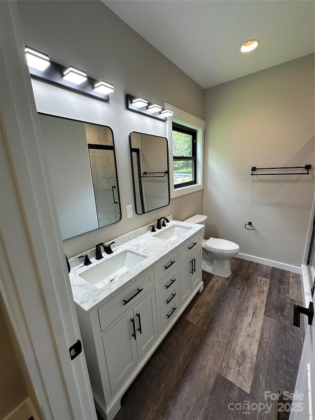 2031 S Oconeechee Ave, Black Mountain, NC 28711 - bathroom featuring a stall shower, wood finished floors, and double vanity