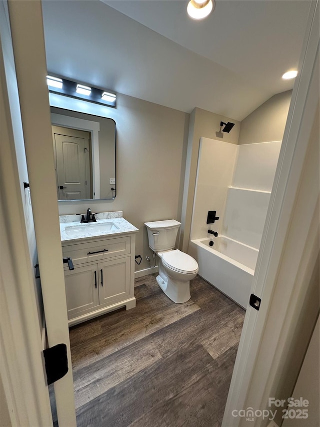 2031 S Oconeechee Ave, Black Mountain, NC 28711 - full bath featuring wood finished floors, vanity, vaulted ceiling, and  shower combination