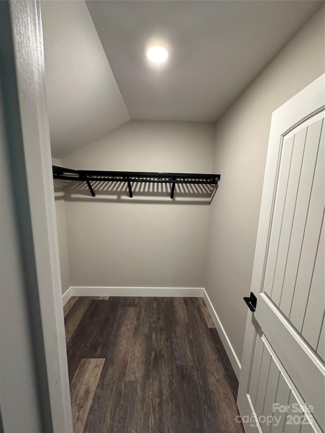 2031 S Oconeechee Ave, Black Mountain, NC 28711 - walk in closet featuring dark wood finished floors and vaulted ceiling