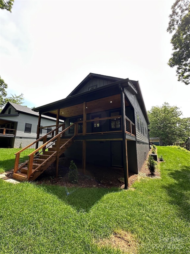 2031 S Oconeechee Ave, Black Mountain, NC 28711 - rear view of property with stairway, a yard, and board and batten siding