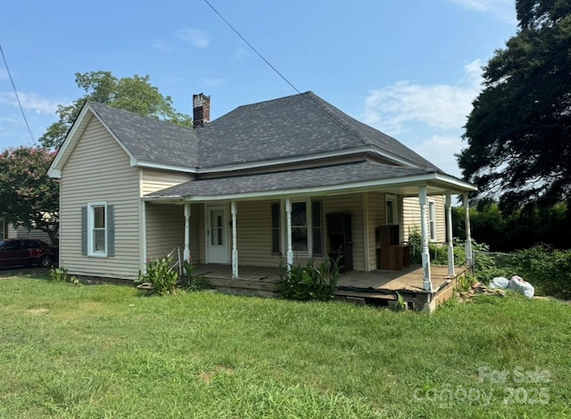 118 Broad St, Shelby, NC 28152 - back of property featuring a shingled roof, a yard, a porch, and a chimney