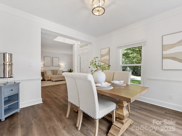 10527 Breamore Dr, Charlotte, NC 28270 - dining room with dark wood-style flooring, ornamental molding, and ornate columns
