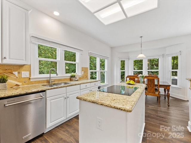 10527 Breamore Dr, Charlotte, NC 28270 - kitchen featuring dishwasher, black electric cooktop, dark wood-style floors, a center island, and light stone countertops