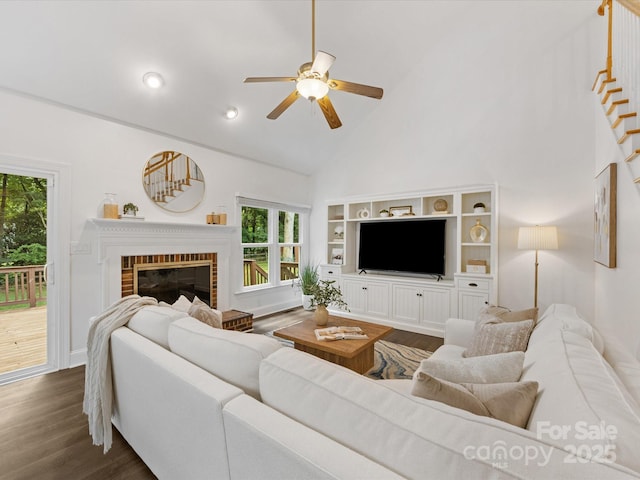 10527 Breamore Dr, Charlotte, NC 28270 - living area with a ceiling fan, high vaulted ceiling, dark wood finished floors, plenty of natural light, and a brick fireplace