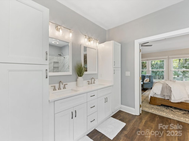 10527 Breamore Dr, Charlotte, NC 28270 - full bath with double vanity, wood finished floors, and a shower
