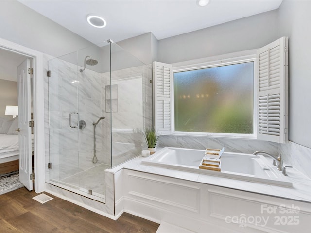 10527 Breamore Dr, Charlotte, NC 28270 - full bath with a garden tub, a marble finish shower, wood finished floors, ensuite bathroom, and recessed lighting