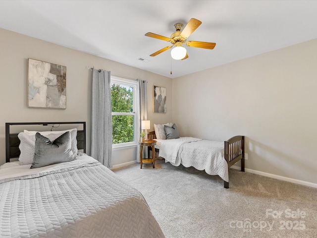 10527 Breamore Dr, Charlotte, NC 28270 - carpeted bedroom with baseboards and a ceiling fan