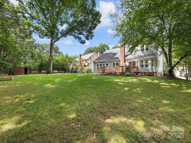 10527 Breamore Dr, Charlotte, NC 28270 - view of grassy yard featuring a deck and an outbuilding