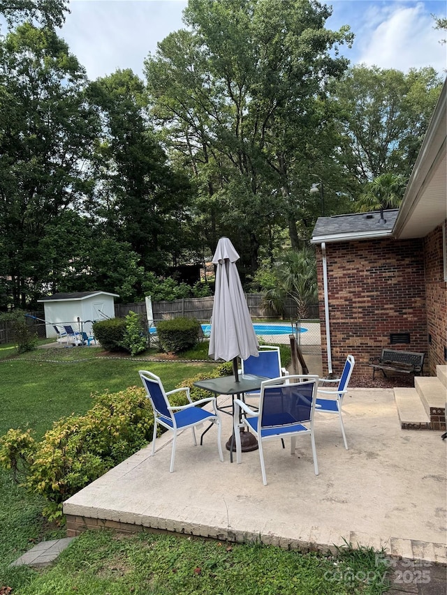 804 Lee St, Kings Mountain, NC 28086 - view of patio / terrace with a storage unit and view of wooded area