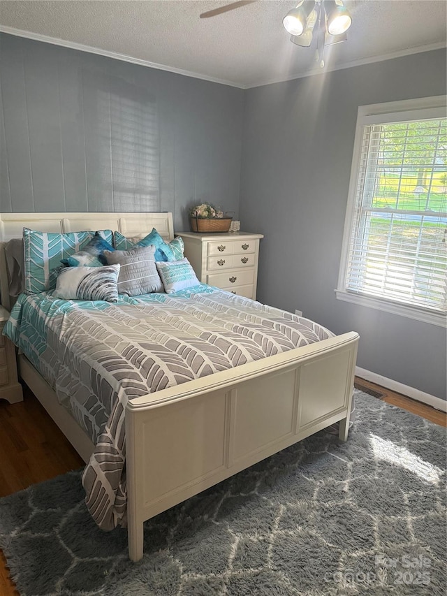 804 Lee St, Kings Mountain, NC 28086 - bedroom featuring crown molding, wood finished floors, a textured ceiling, and a ceiling fan