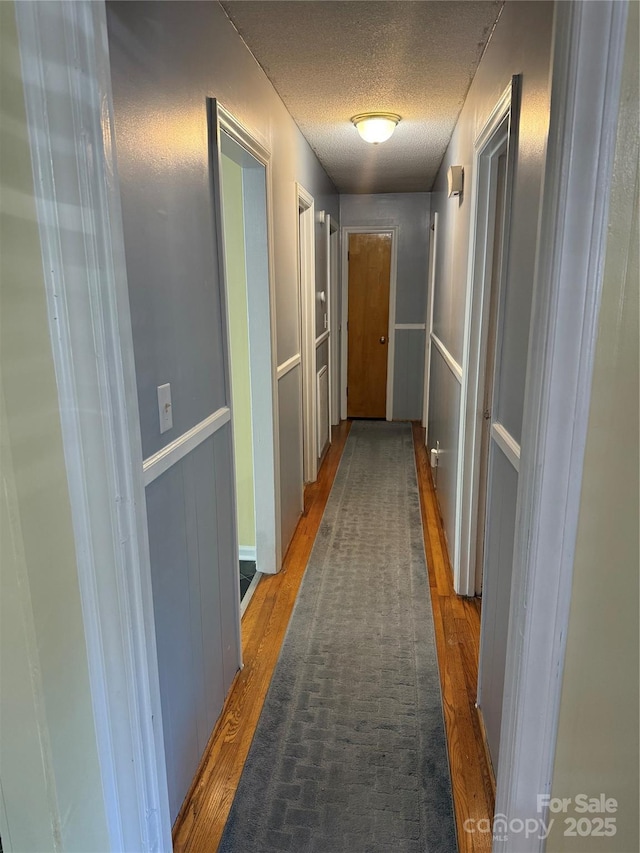 804 Lee St, Kings Mountain, NC 28086 - corridor featuring wood finished floors and a textured ceiling
