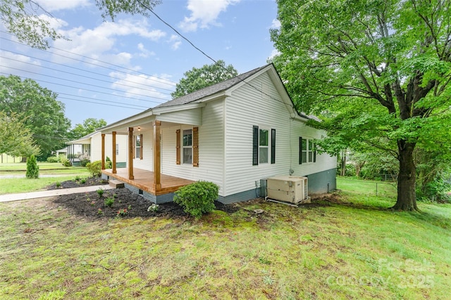 617 N Juniper Ave, Kannapolis, NC 28081 - view of property exterior featuring covered porch and a yard