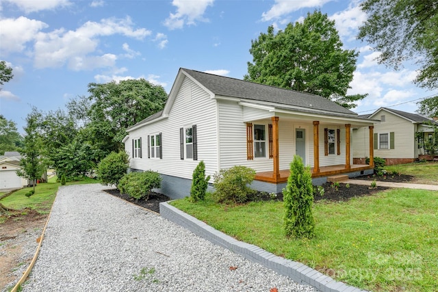 617 N Juniper Ave, Kannapolis, NC 28081 - view of front of home featuring covered porch and a front lawn