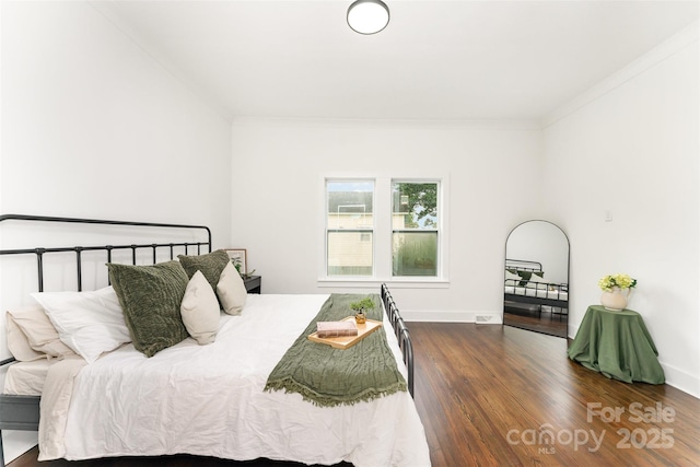 617 N Juniper Ave, Kannapolis, NC 28081 - bedroom featuring wood finished floors and crown molding