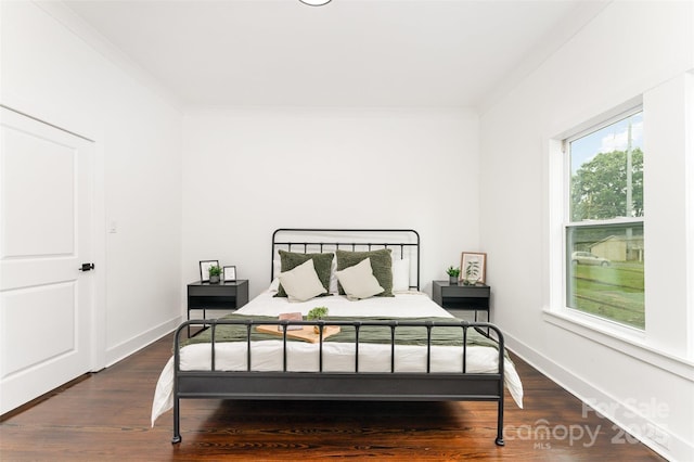617 N Juniper Ave, Kannapolis, NC 28081 - bedroom with crown molding and dark wood-style flooring