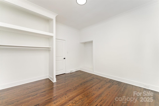 617 N Juniper Ave, Kannapolis, NC 28081 - unfurnished bedroom with crown molding, dark wood-style floors, and a closet