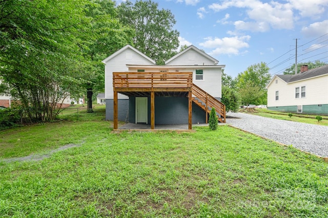 617 N Juniper Ave, Kannapolis, NC 28081 - back of property featuring a deck, a lawn, stairway, and driveway