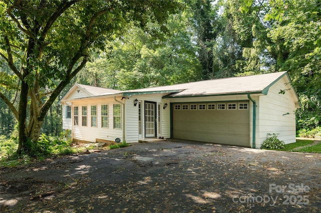 18 Peaceful Valley Ln, Flat Rock, NC 28731 - ranch-style home featuring asphalt driveway and an attached garage