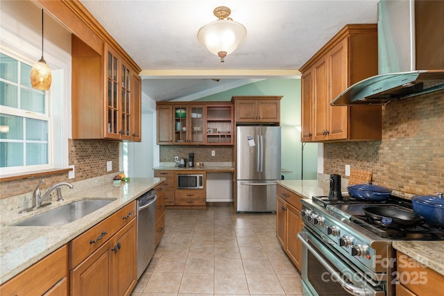 18 Peaceful Valley Ln, Flat Rock, NC 28731 - kitchen featuring appliances with stainless steel finishes, wall chimney range hood, backsplash, brown cabinets, and light stone counters