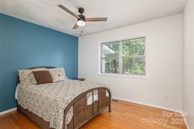 18 Peaceful Valley Ln, Flat Rock, NC 28731 - bedroom with wood finished floors and a ceiling fan