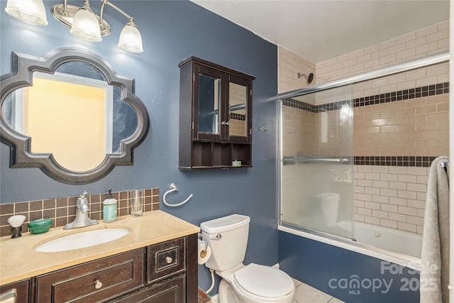 18 Peaceful Valley Ln, Flat Rock, NC 28731 - bathroom featuring vanity, shower / bath combination with glass door, tasteful backsplash, and tile patterned floors