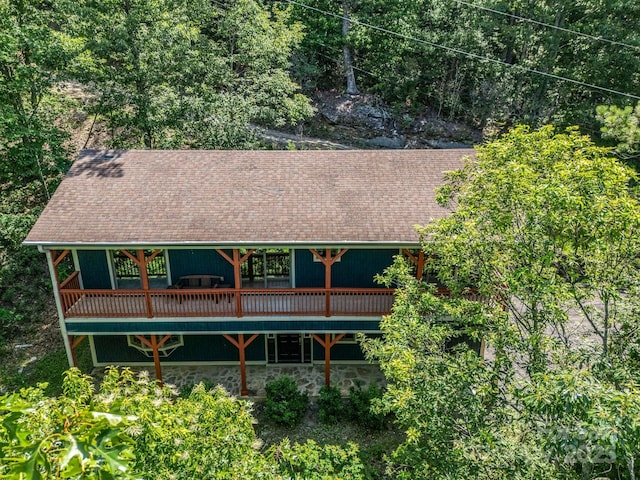 291 Pine Ridge Rd, Hendersonville, NC 28792 - rear view of property featuring a wooden deck, roof with shingles, and stone siding