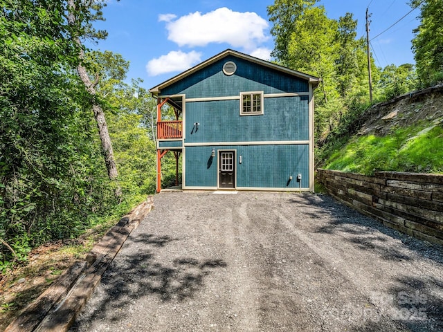 291 Pine Ridge Rd, Hendersonville, NC 28792 - view of front facade featuring driveway and a balcony