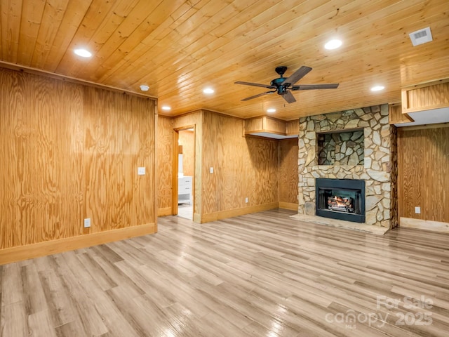 291 Pine Ridge Rd, Hendersonville, NC 28792 - unfurnished living room featuring wood ceiling, a ceiling fan, a stone fireplace, wood finished floors, and recessed lighting