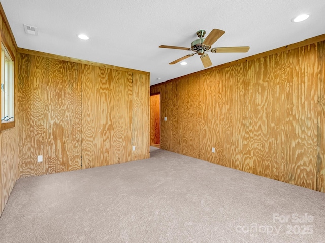 291 Pine Ridge Rd, Hendersonville, NC 28792 - unfurnished room featuring carpet flooring, a ceiling fan, wooden walls, and recessed lighting