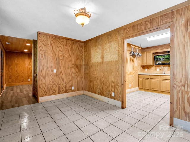 291 Pine Ridge Rd, Hendersonville, NC 28792 - unfurnished dining area featuring wood walls and light tile patterned floors
