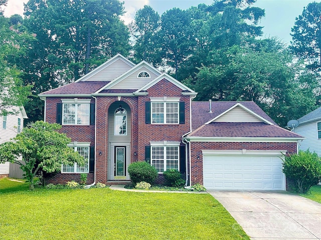 2834 Ritz Ln, Matthews, NC 28105 - view of front of property featuring driveway, an attached garage, a front yard, brick siding, and roof with shingles