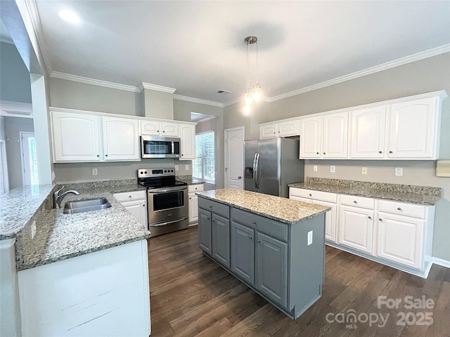 2834 Ritz Ln, Matthews, NC 28105 - kitchen with stainless steel appliances, gray cabinetry, white cabinets, crown molding, and light stone countertops