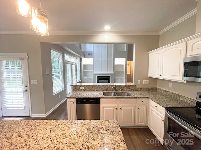 2834 Ritz Ln, Matthews, NC 28105 - kitchen with stainless steel appliances, crown molding, dark wood-style floors, light stone countertops, and white cabinetry