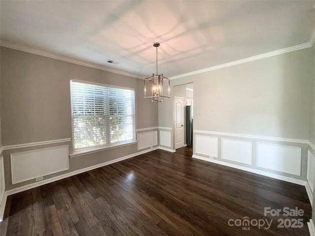 2834 Ritz Ln, Matthews, NC 28105 - unfurnished dining area featuring a chandelier, dark wood-type flooring, wainscoting, ornamental molding, and a decorative wall