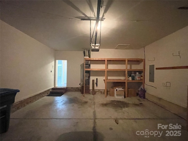 2834 Ritz Ln, Matthews, NC 28105 - garage featuring electric panel and a garage door opener