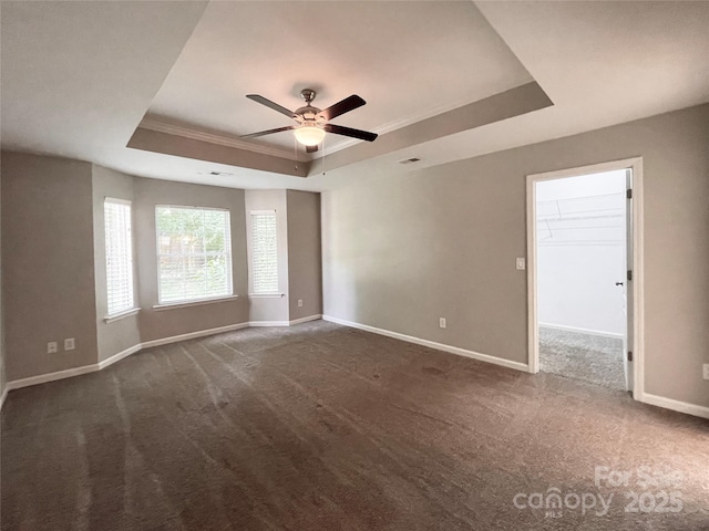 2834 Ritz Ln, Matthews, NC 28105 - empty room with a tray ceiling, crown molding, dark carpet, and ceiling fan