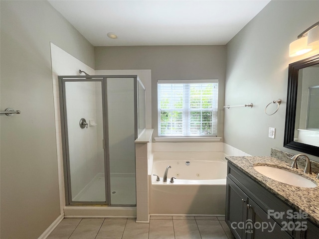 2834 Ritz Ln, Matthews, NC 28105 - bathroom with vanity, a whirlpool tub, a shower stall, and tile patterned floors